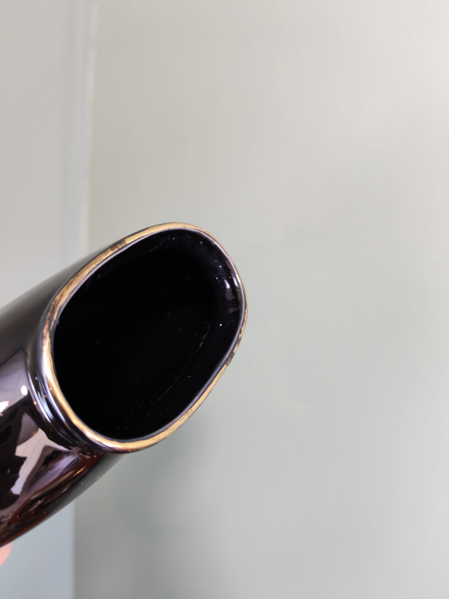 Black ceramic vase with a floral design