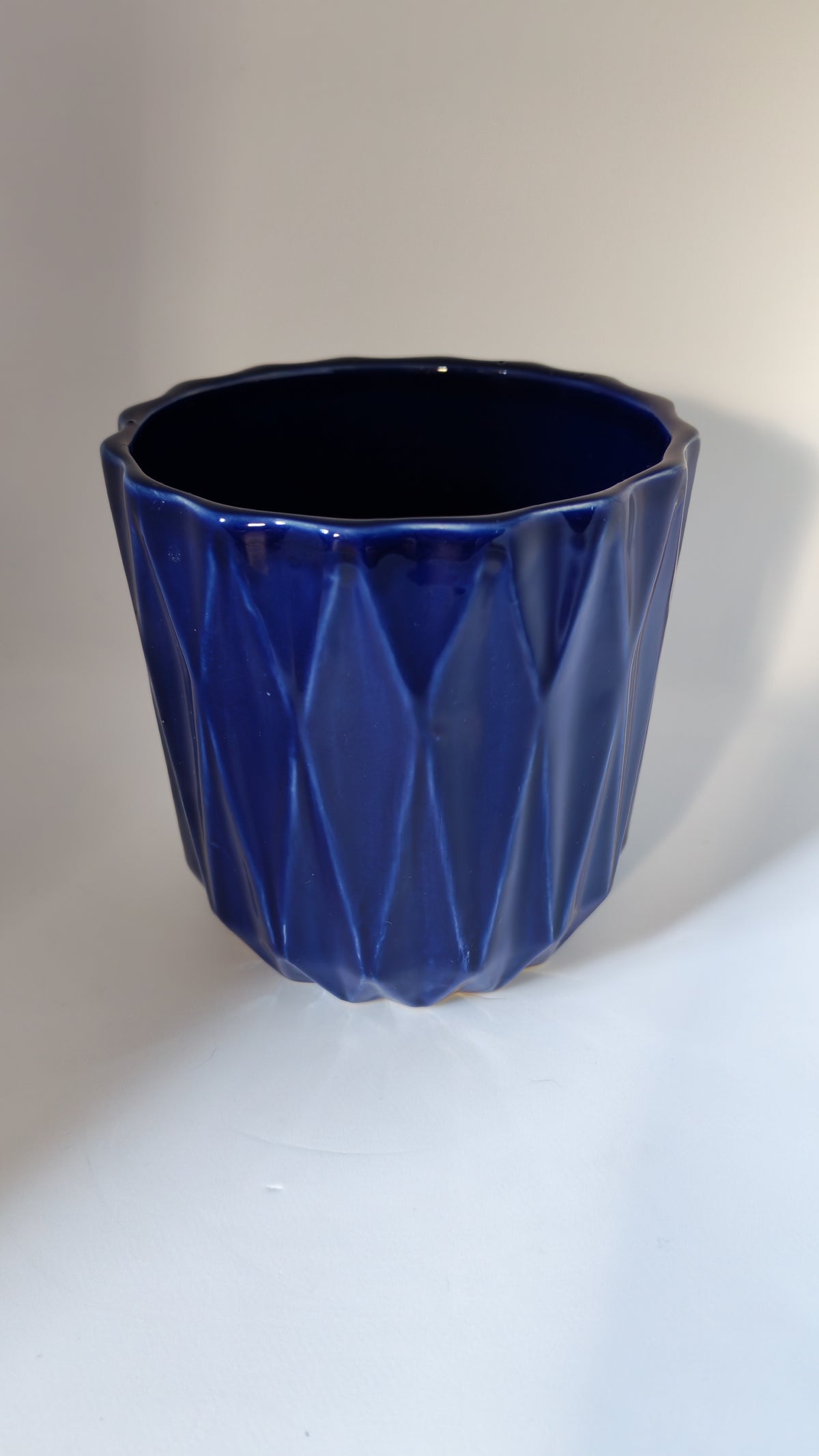 Cobalt blue flowerpot with a geometric pattern