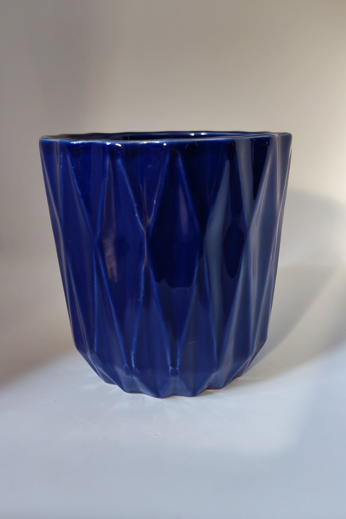 Cobalt blue flowerpot with a geometric pattern