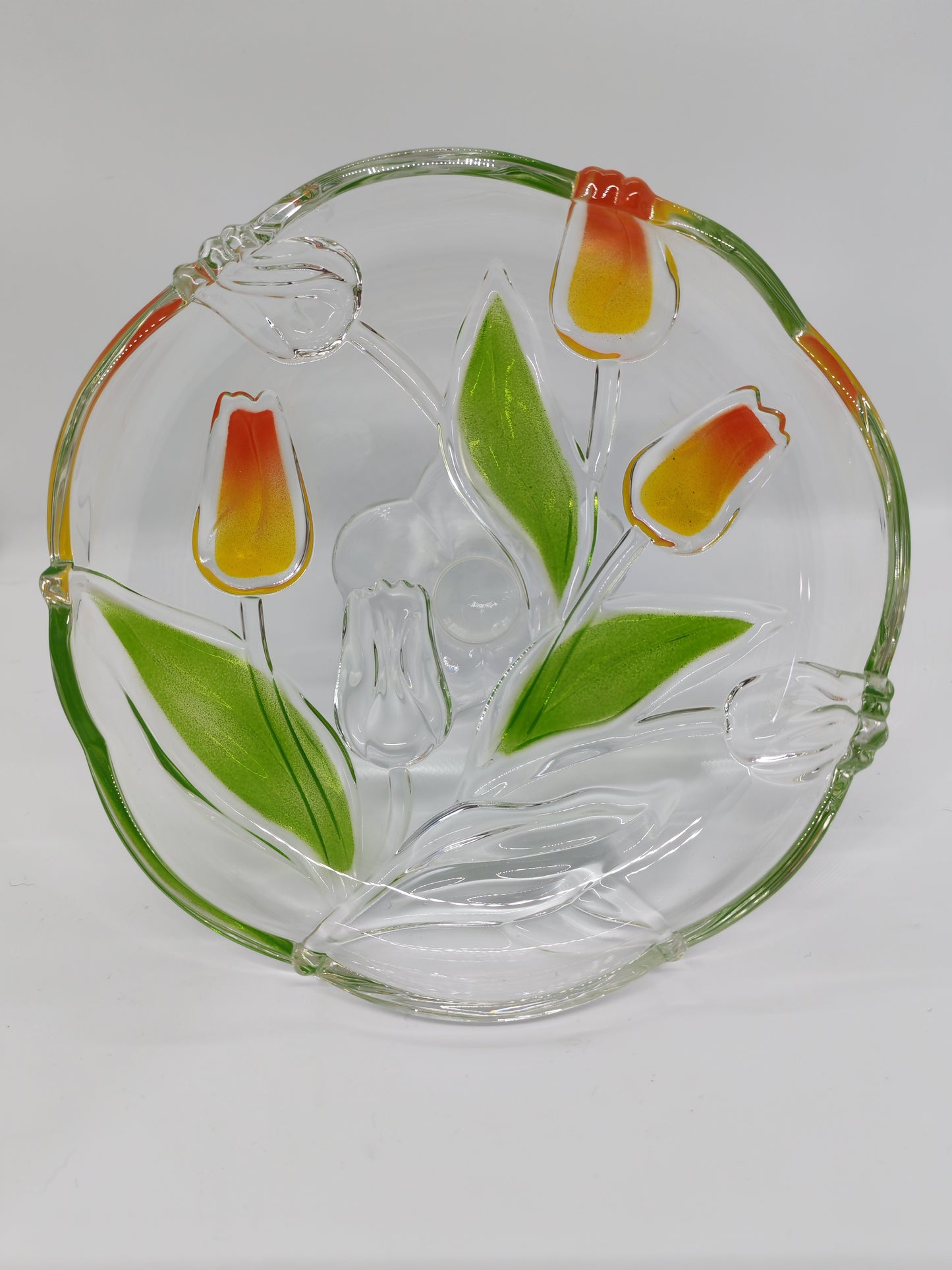 Glass serving platter with a stem and tulip motif