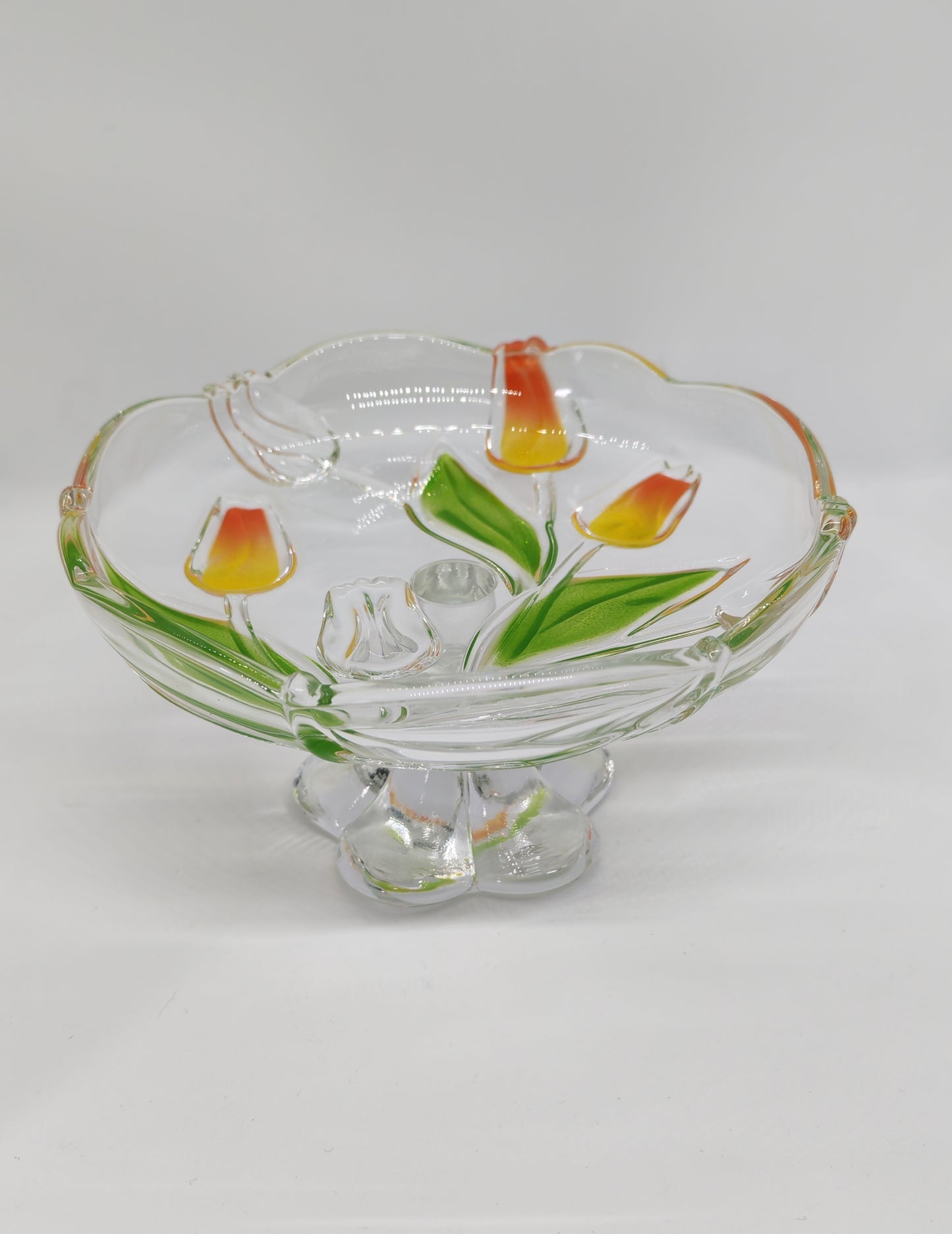 Glass serving platter with a stem and tulip motif