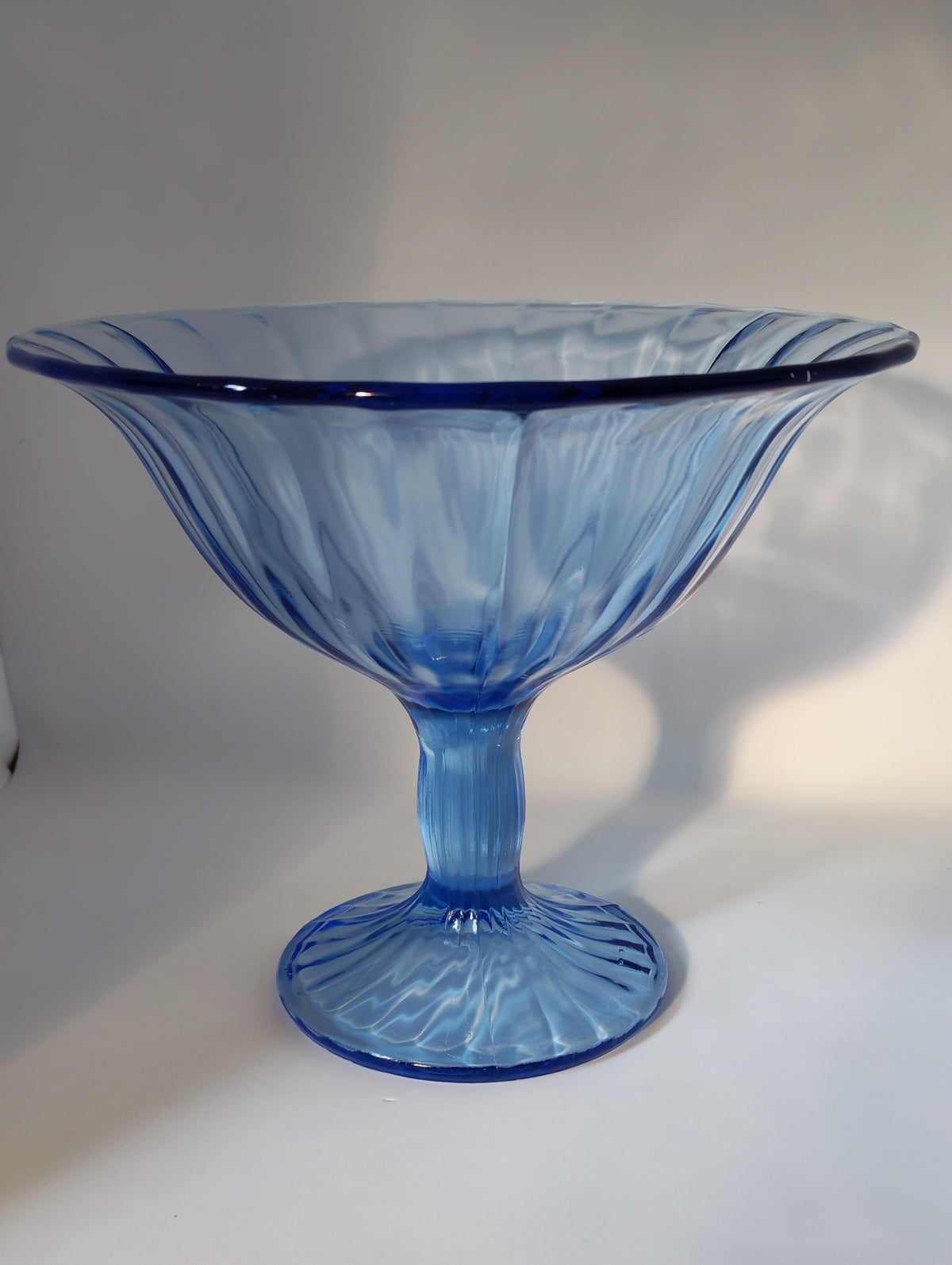 Blue stemmed glass bowl