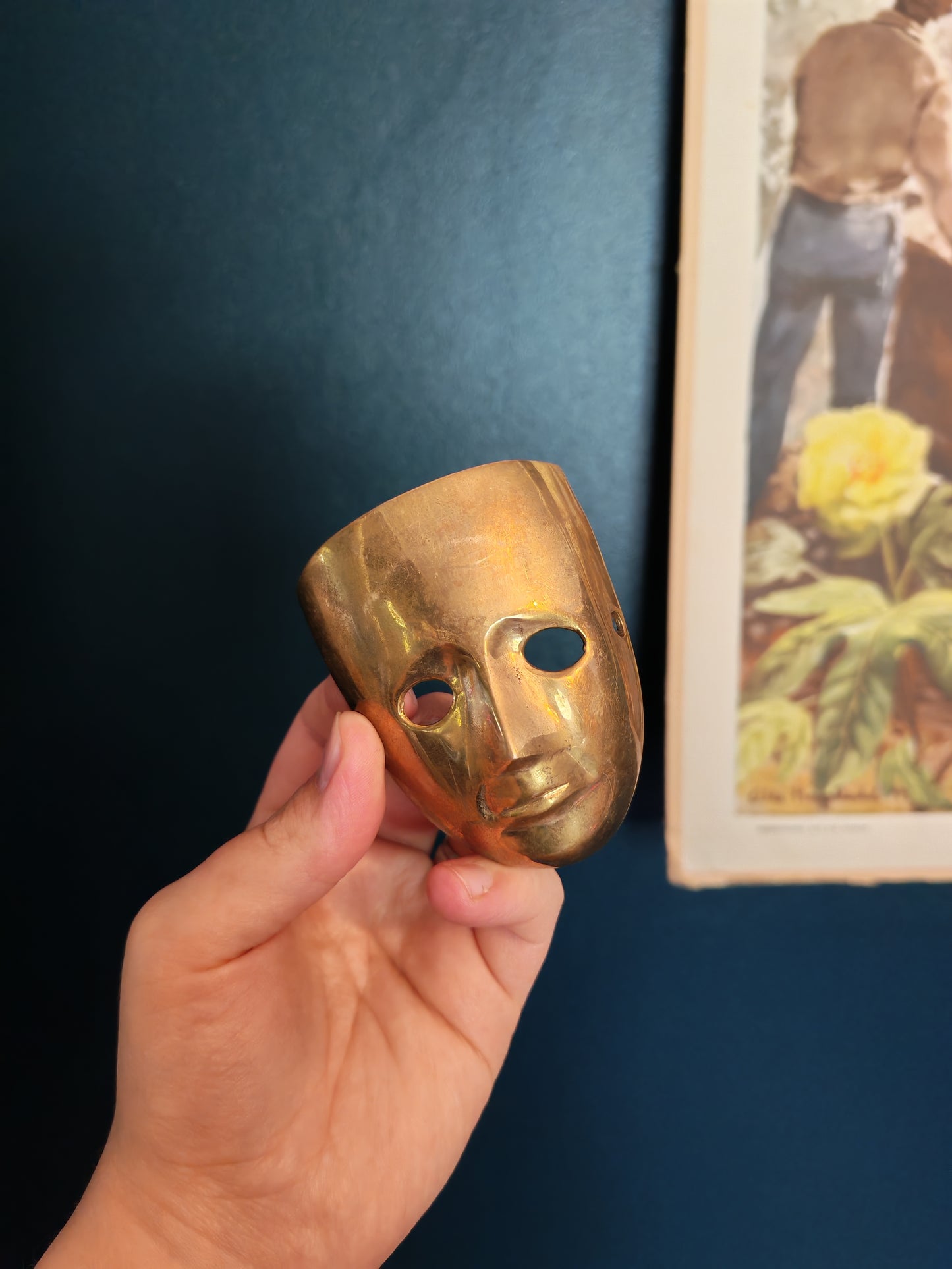 A small brass mask
