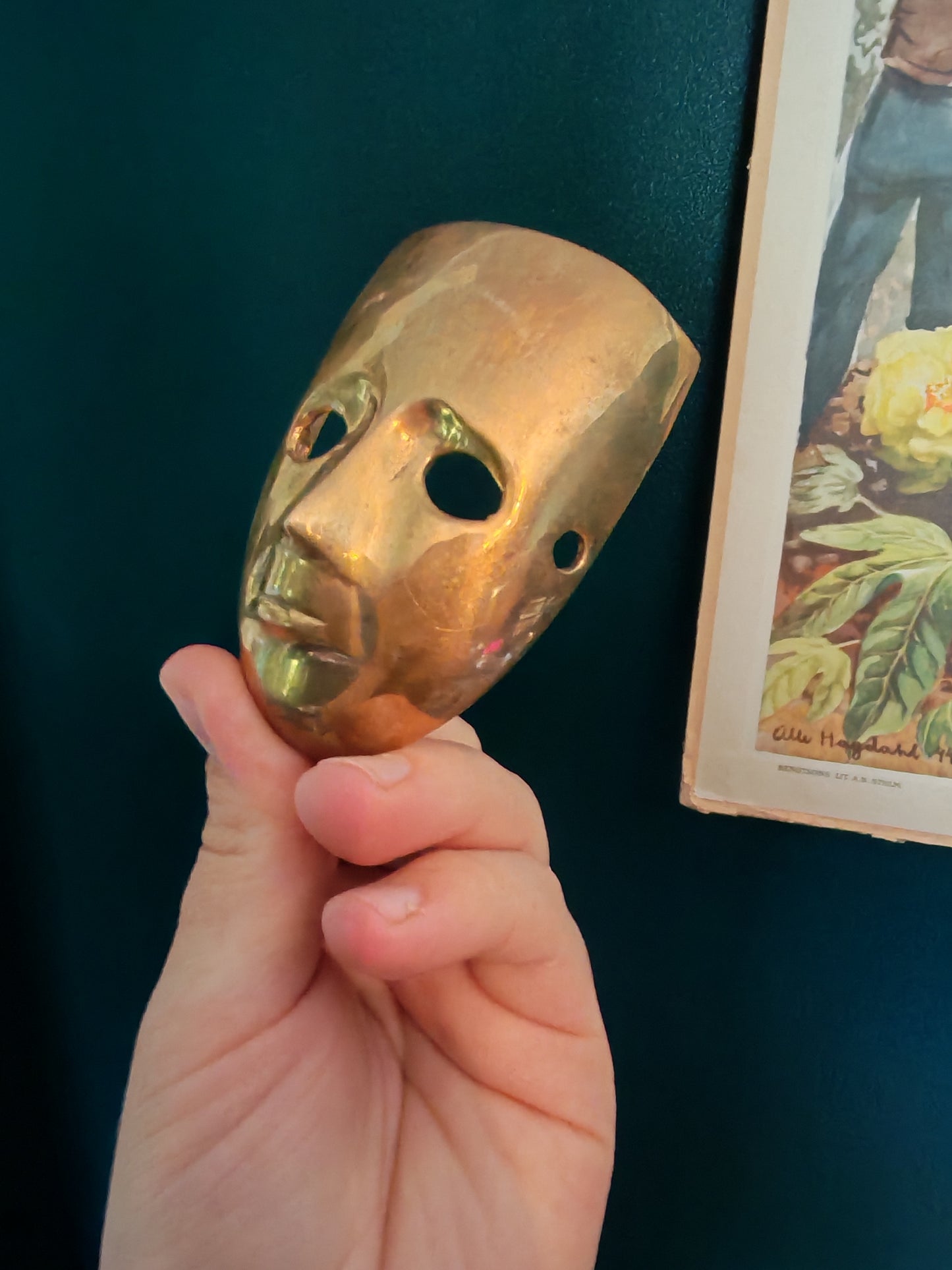 A small brass mask