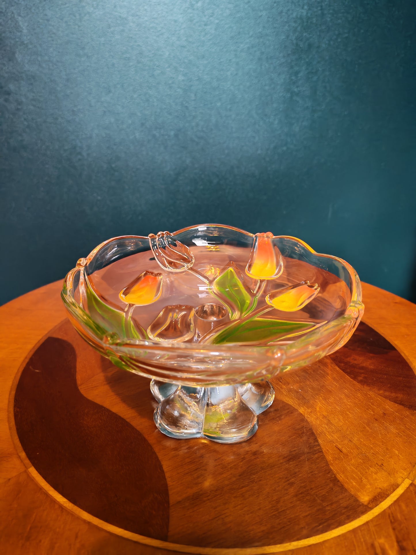 Glass serving platter with a stem and tulip motif