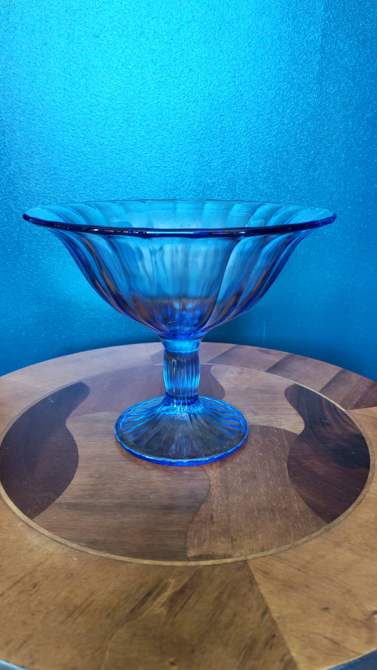 Blue stemmed glass bowl