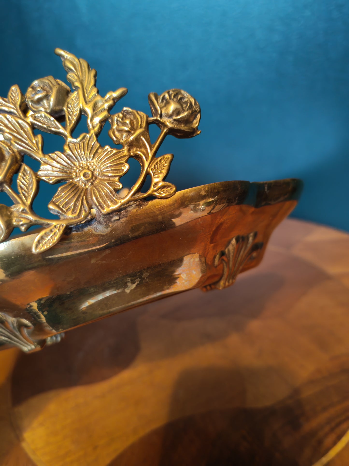Small brass tray with floral decorations and a handle
