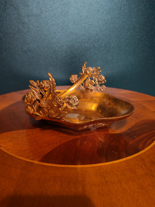 Small brass tray with floral decorations and a handle
