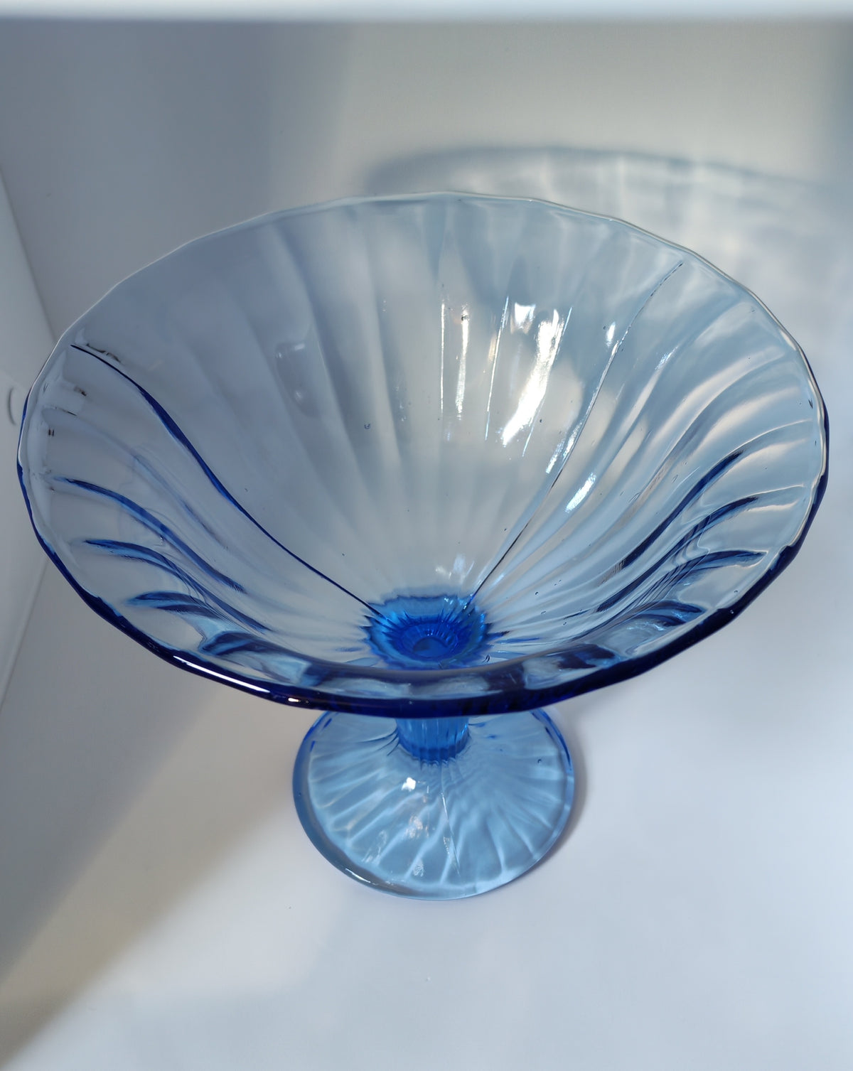 Blue stemmed glass bowl