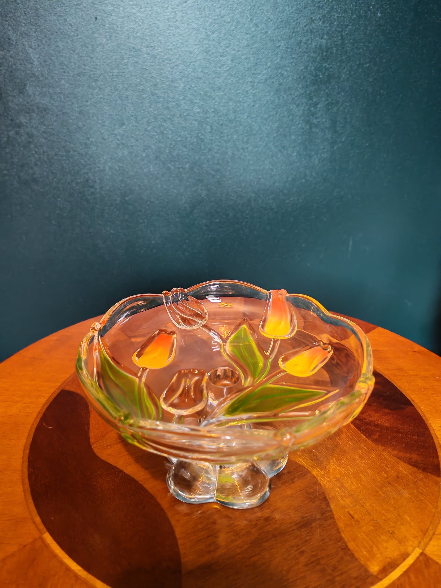 Glass serving platter with a stem and tulip motif