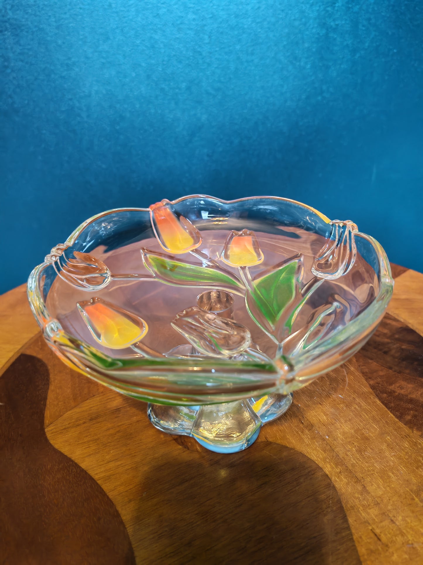 Glass serving platter with a stem and tulip motif