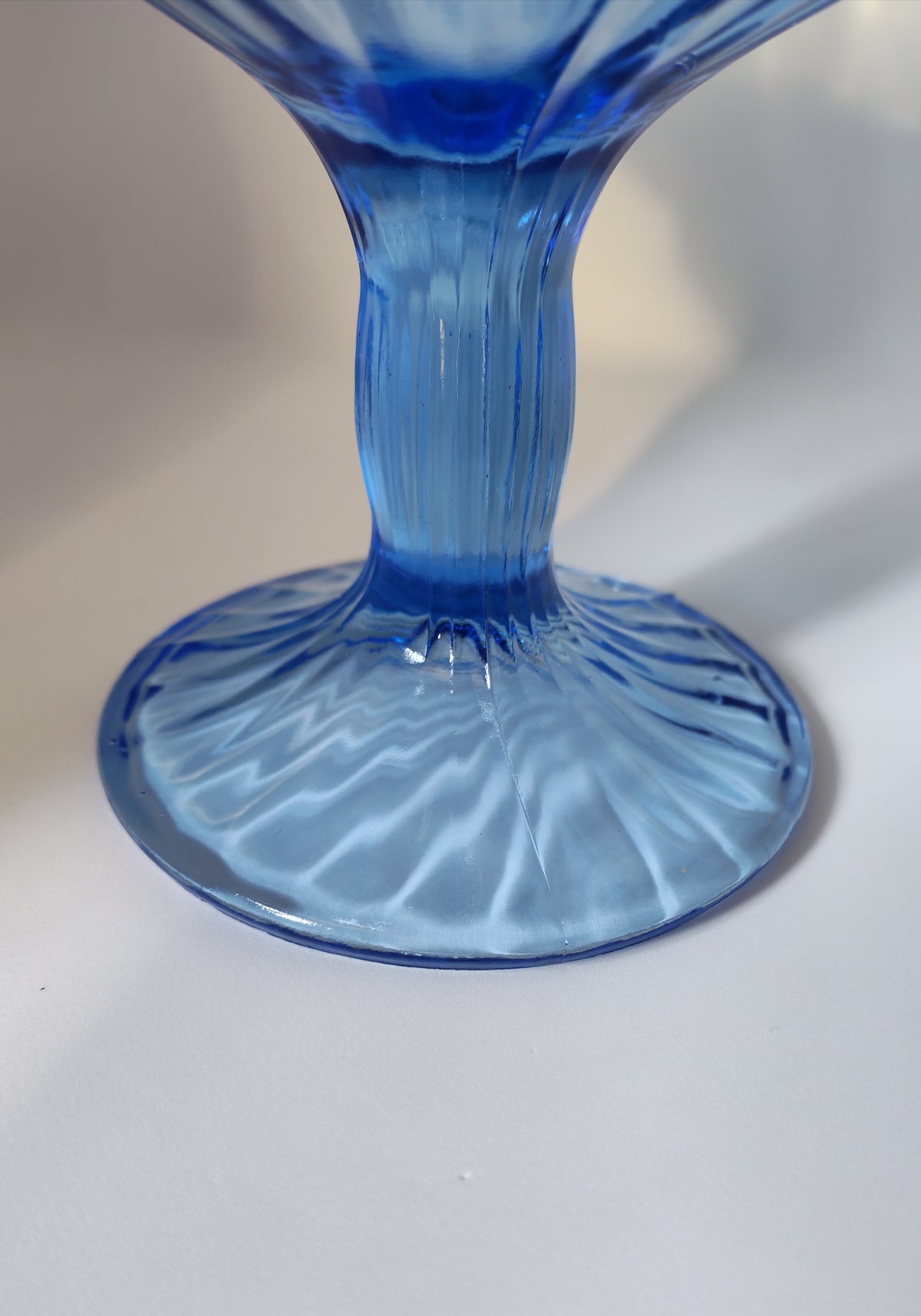 Blue stemmed glass bowl