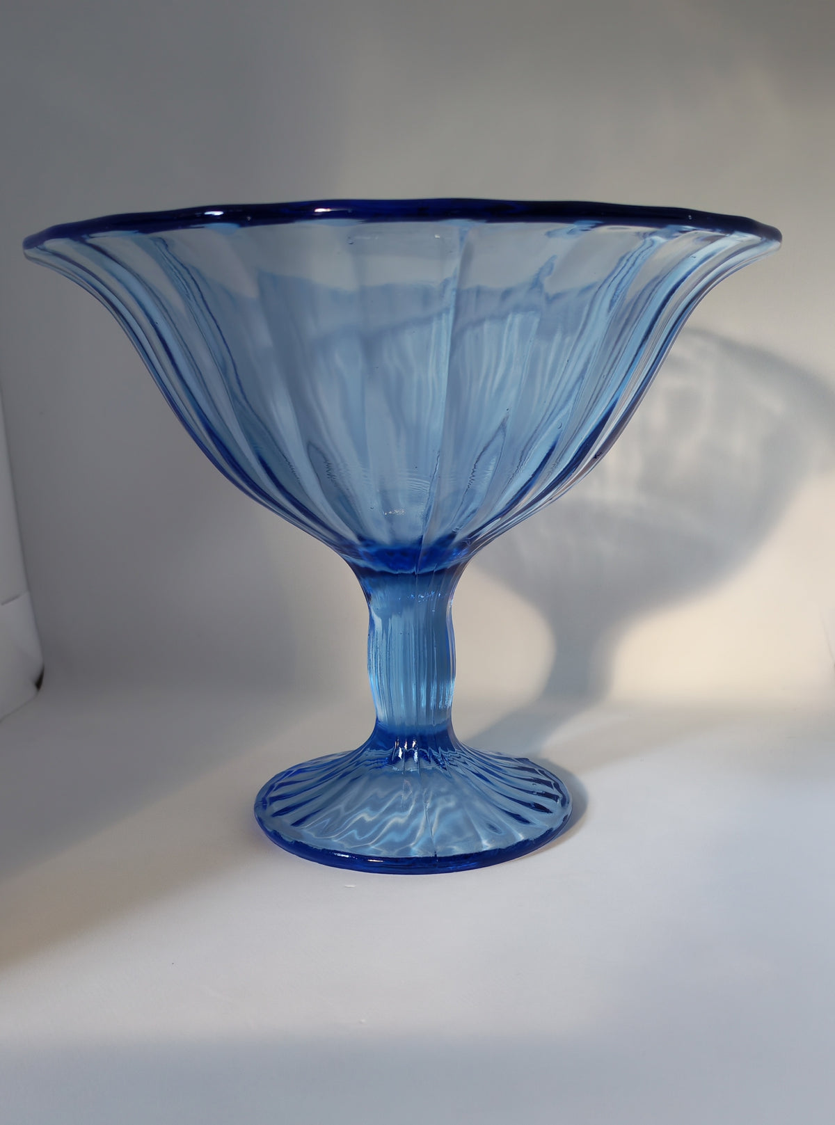Blue stemmed glass bowl
