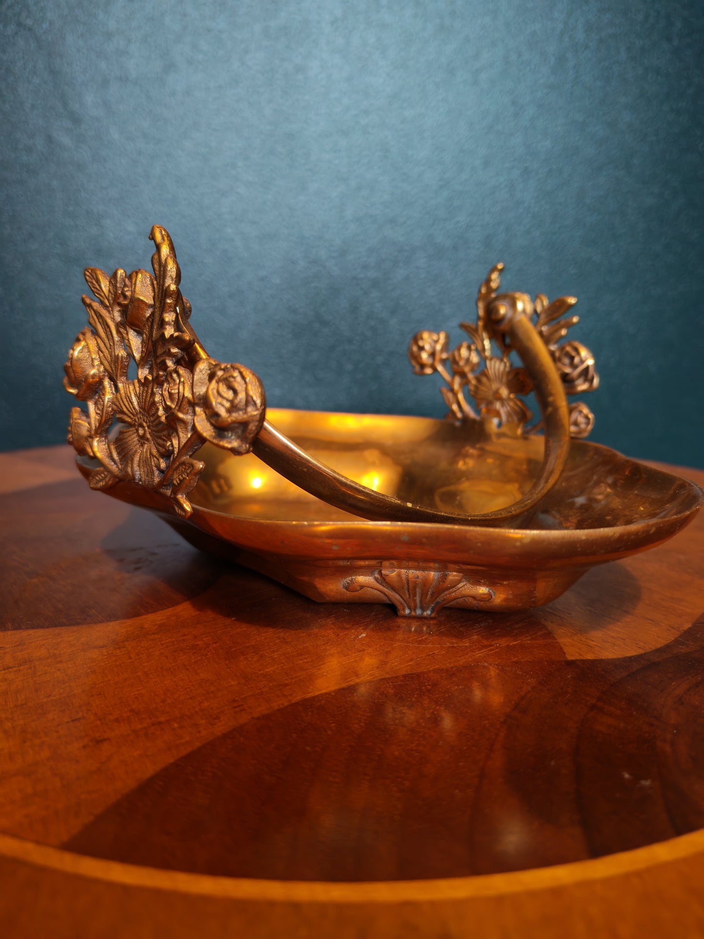 Small brass tray with floral decorations and a handle