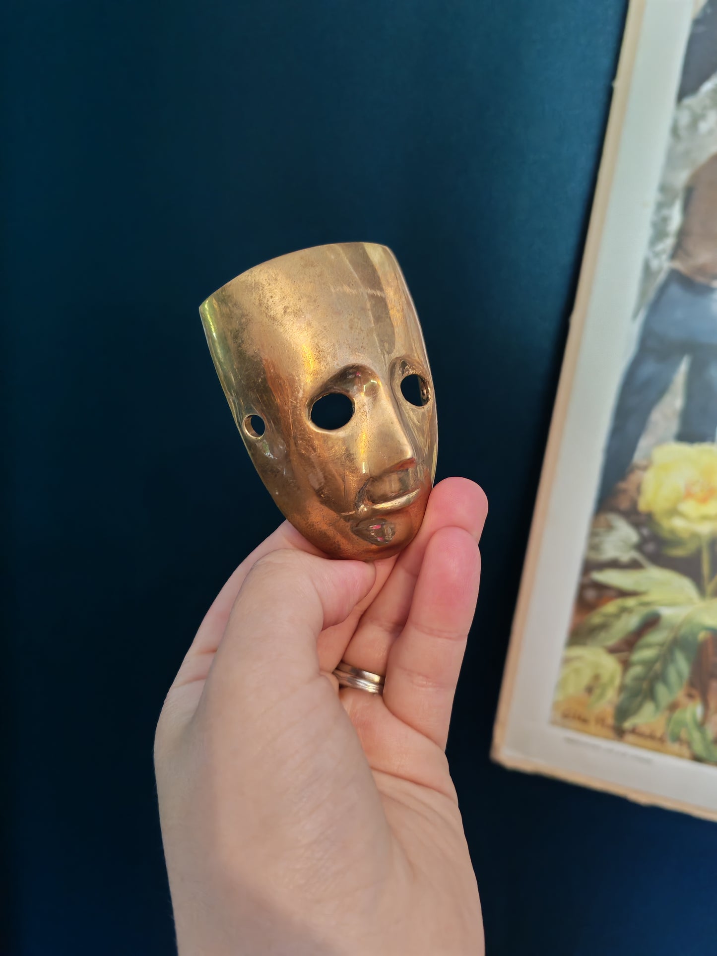 A small brass mask