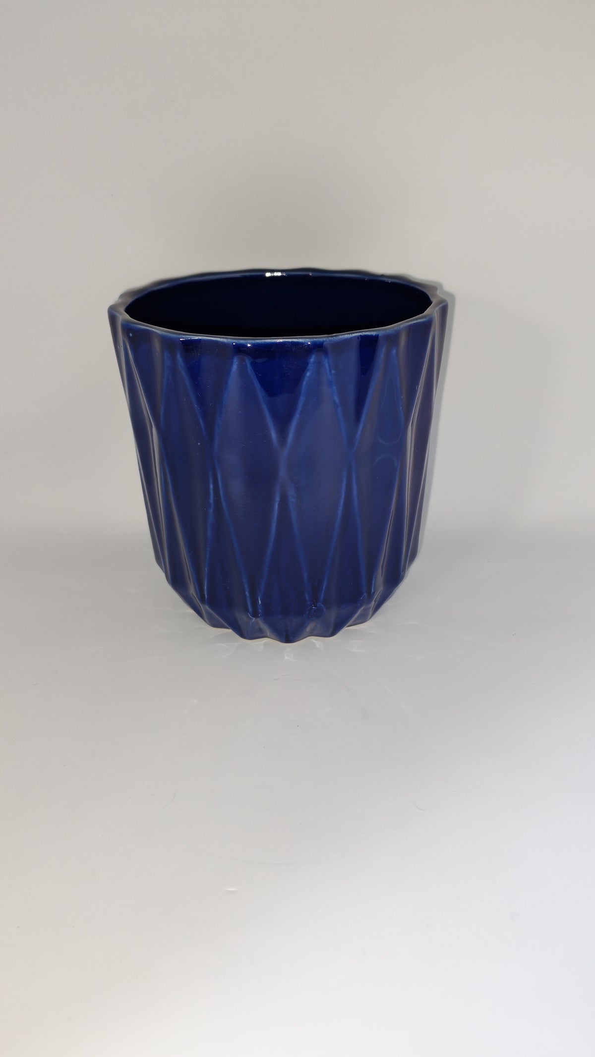 Cobalt blue flowerpot with a geometric pattern