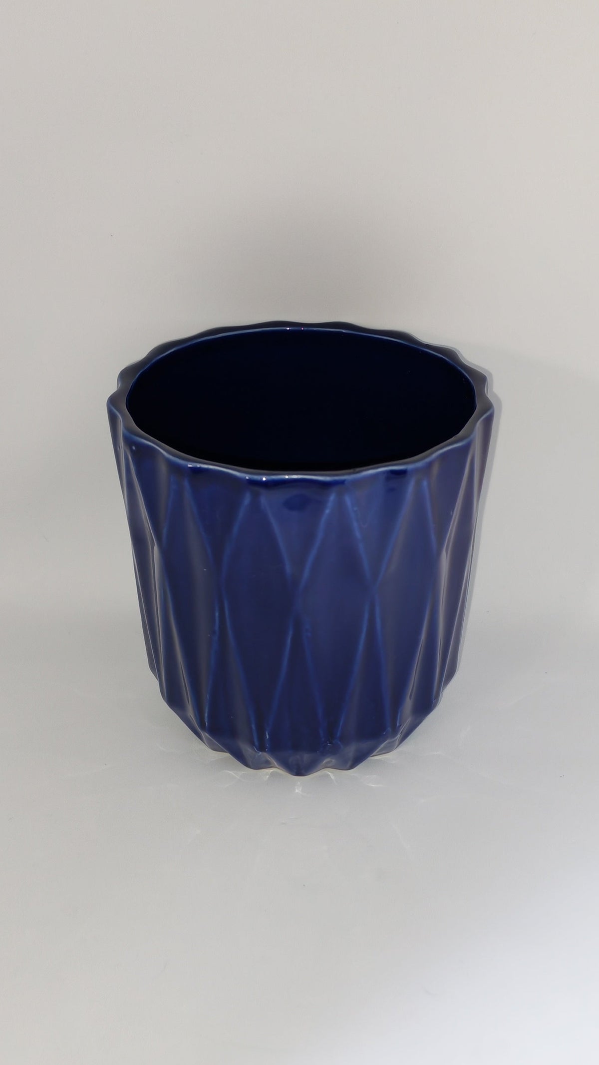Cobalt blue flowerpot with a geometric pattern