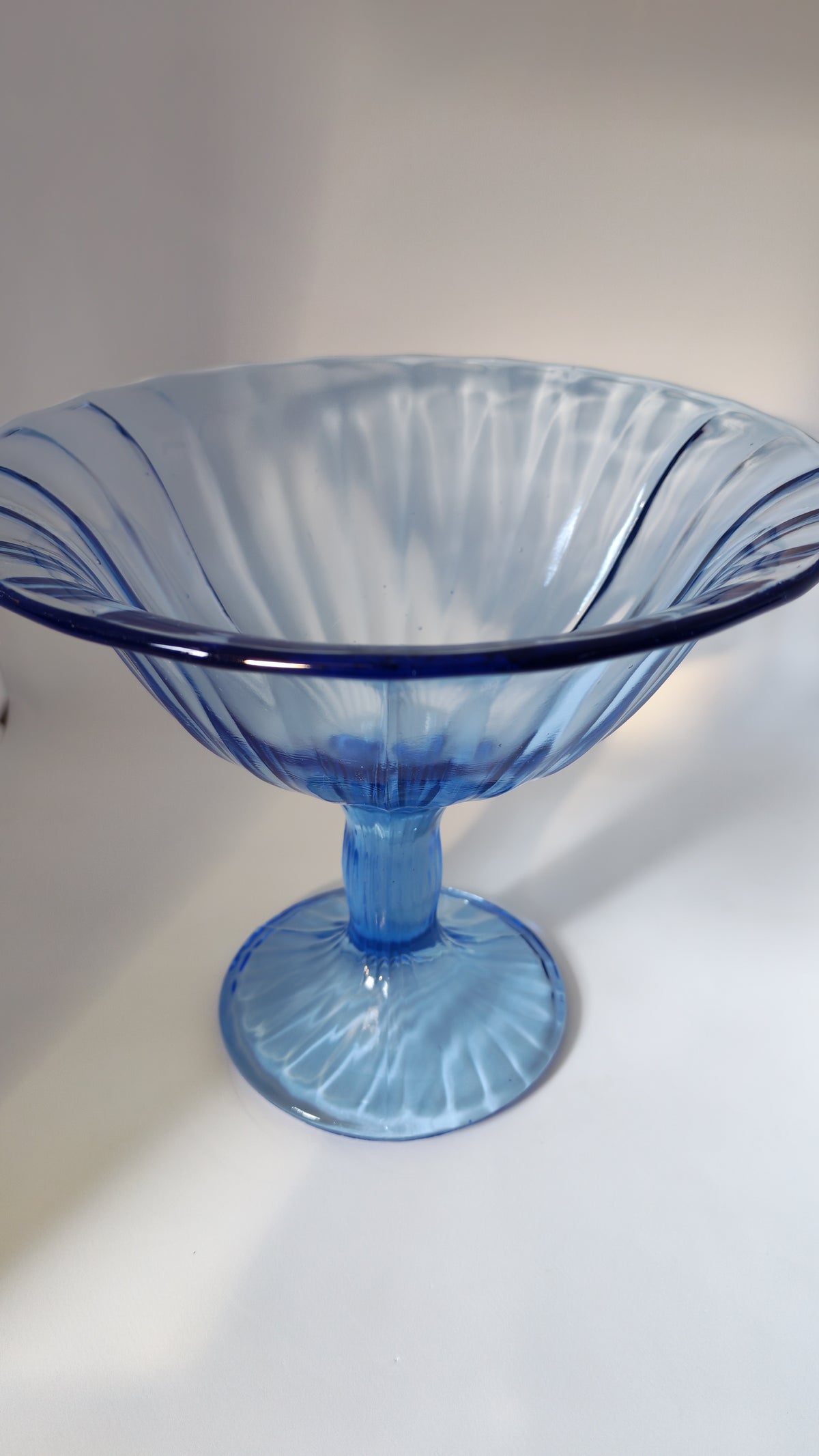 Blue stemmed glass bowl
